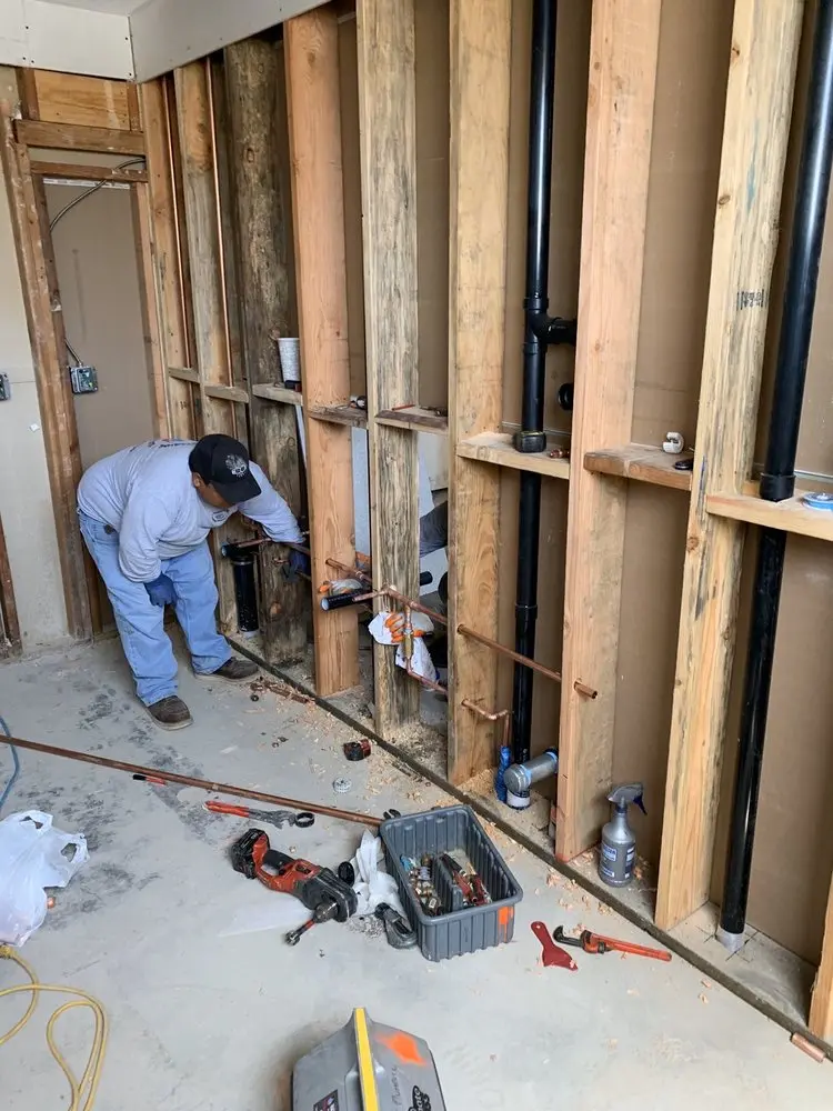 Commercial rough-in plumbing for Water Heater Replacement in De La Salle